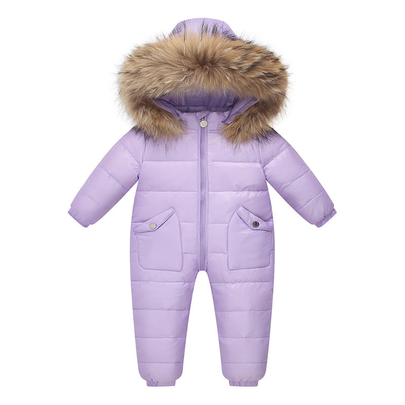 The Baby Wears White Eiderdown Over A Onesie And Down Jacket